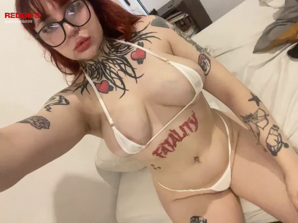 Thick Redhead Goth Goddess Teases in Tiny White Slingshot Bikini