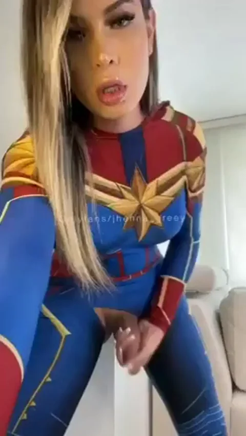 Beautiful shemale handles her half-flaccid cock for our contemplation