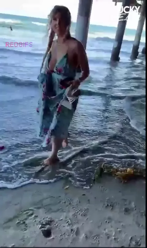 Lena Paul's Slutty Beach Tease: Massive Tits Spill Out in Sheer Bikini