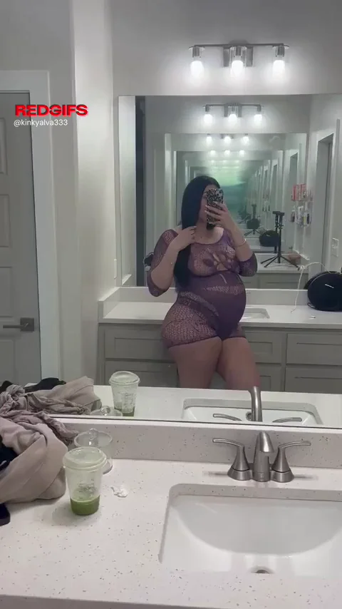 Preggo Goddess Flaunts Her Swollen Belly in Sheer Lingerie