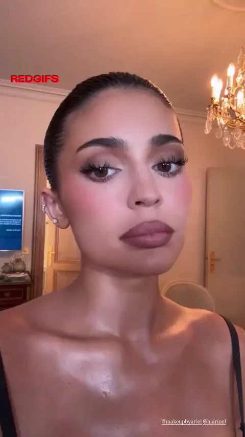 Kylie Jenner's Sultry Cleavage Tease in Luxe Bedroom Glow