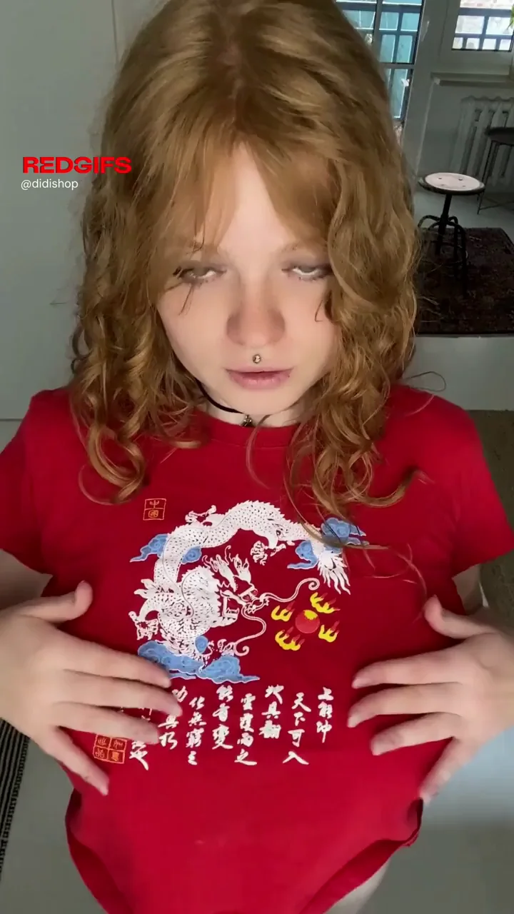 Redhead Busty Bombshell Teases Massive Tits in Tight Tee