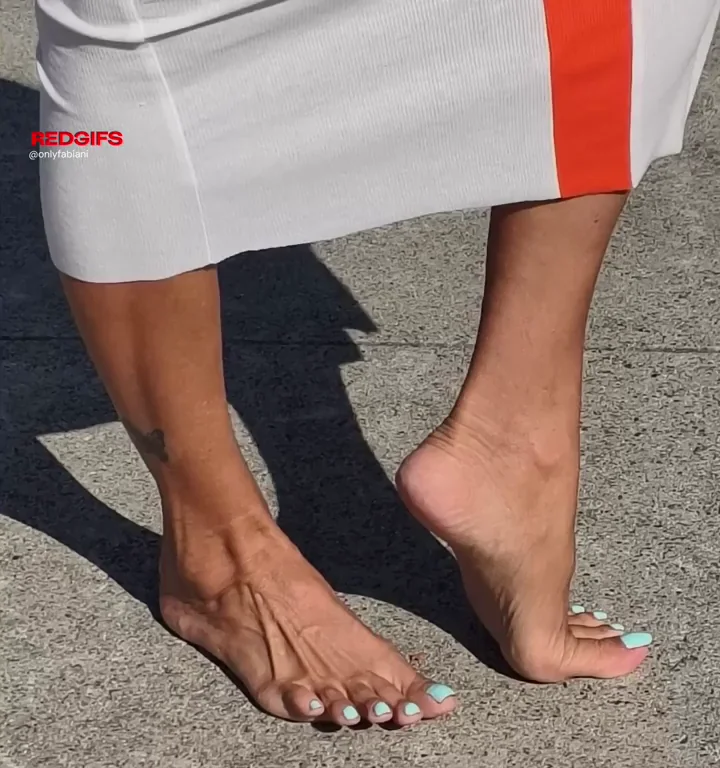 MILF's Barefoot Tease on Gritty Pavement