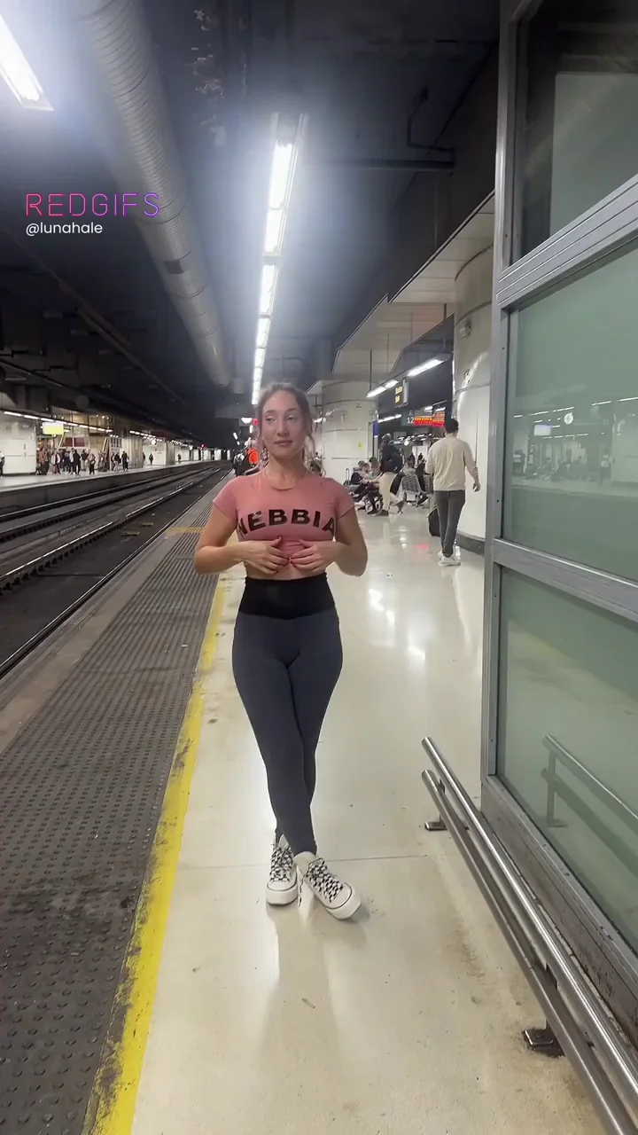 Slutty Train Station Flash: Pierced Nipples Bared Under Harsh Lights