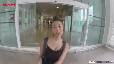 a slutty asian getting her big tits covered with a load in public