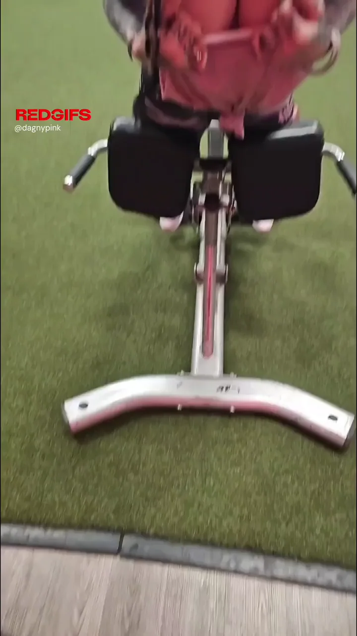 Muscular MILF Gym Flash: Tits Out on the Leg Machine