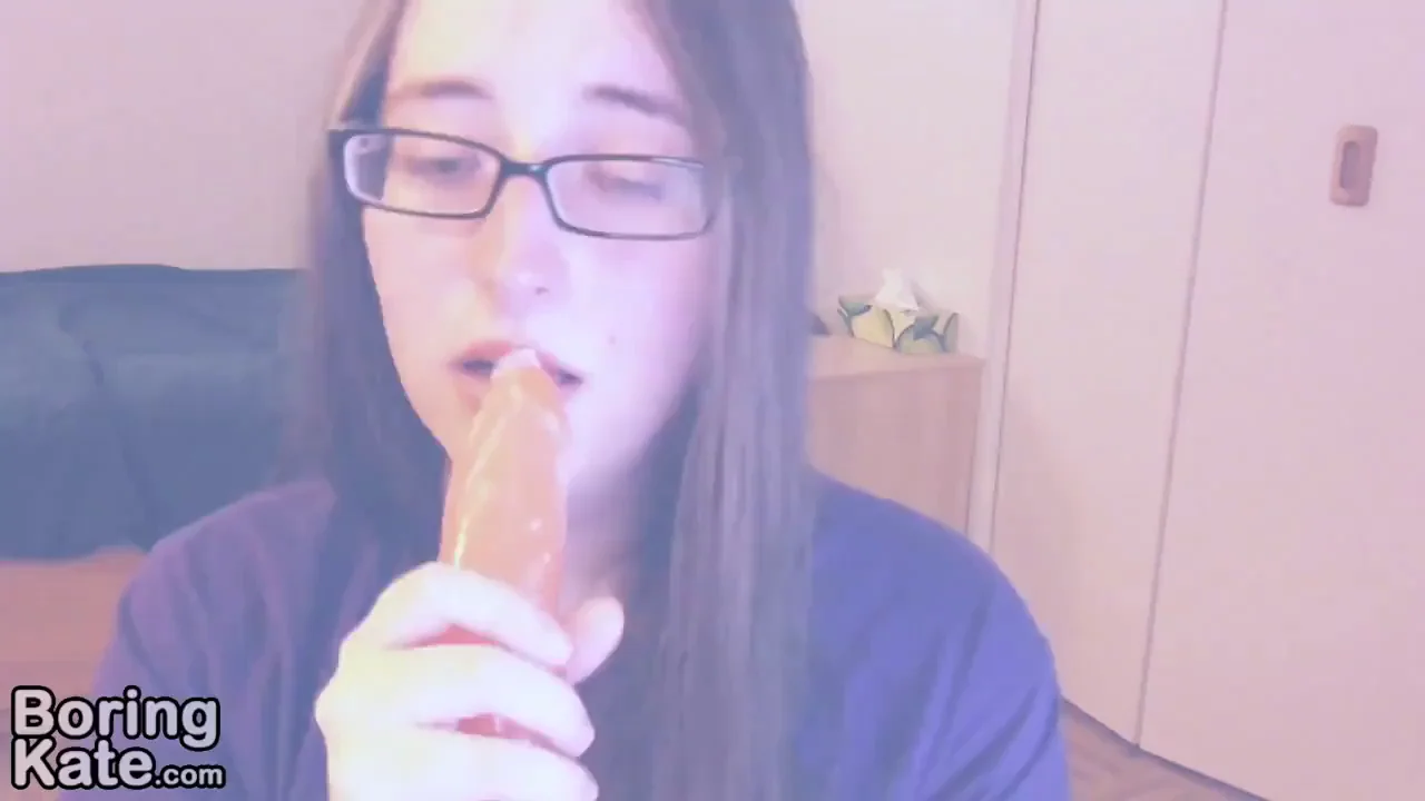 Slutty Specs Girl Greets Cum Dumpers with Throaty Dildo Suck-Off