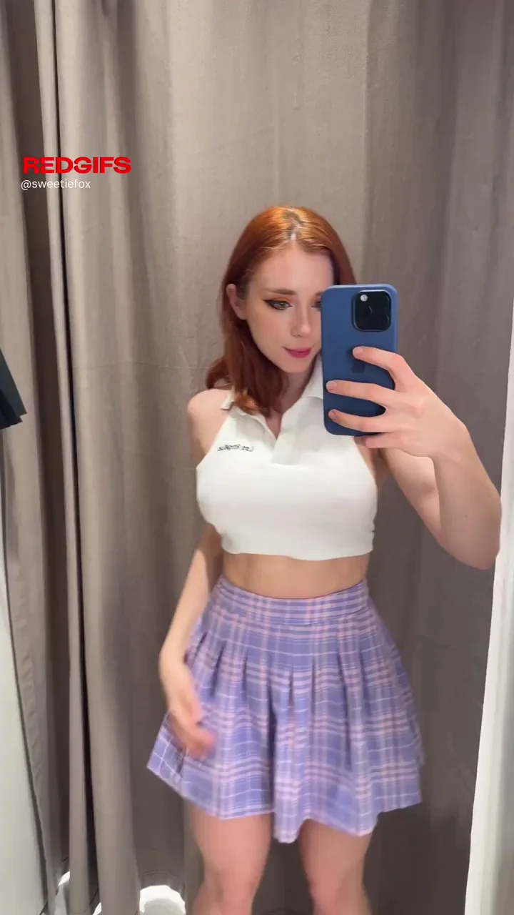 Redhead tits reveal in fitting room