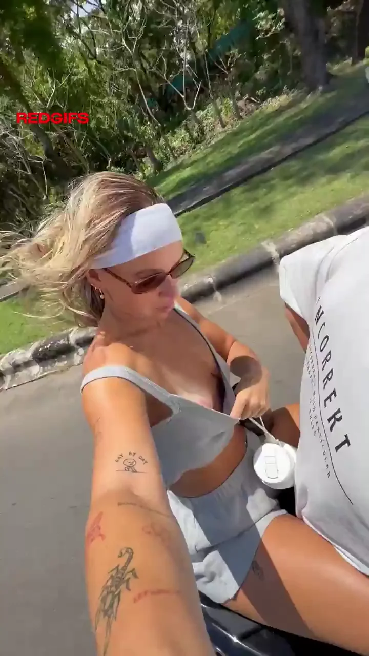 cheeky flash and finger on the back of the scooter