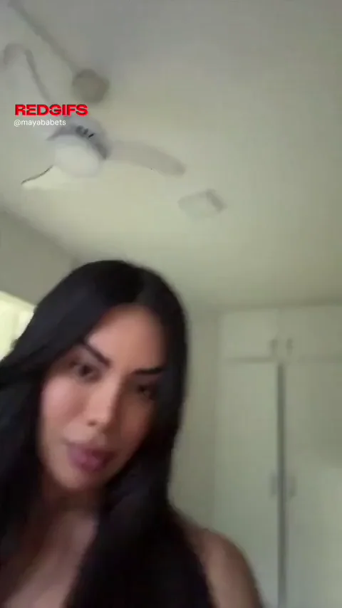 The room shifts the moment she reveals her cock