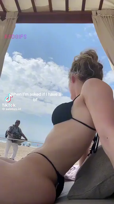 🍑 @Abby.IRL's Juicy Bikini Ass Tease on the Beach! 🔥