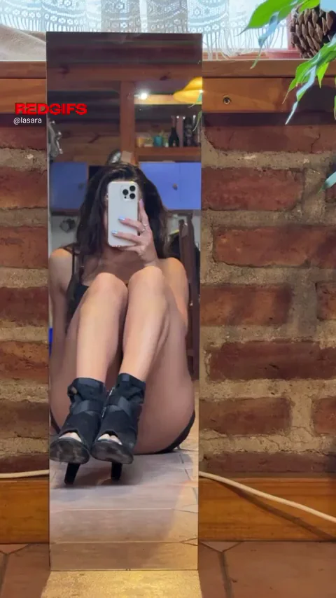 Mirror, heels, and just enough tease… would you kneel here or keep watching?