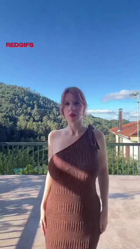 Fiery Redhead Busting Out in Tight Dress