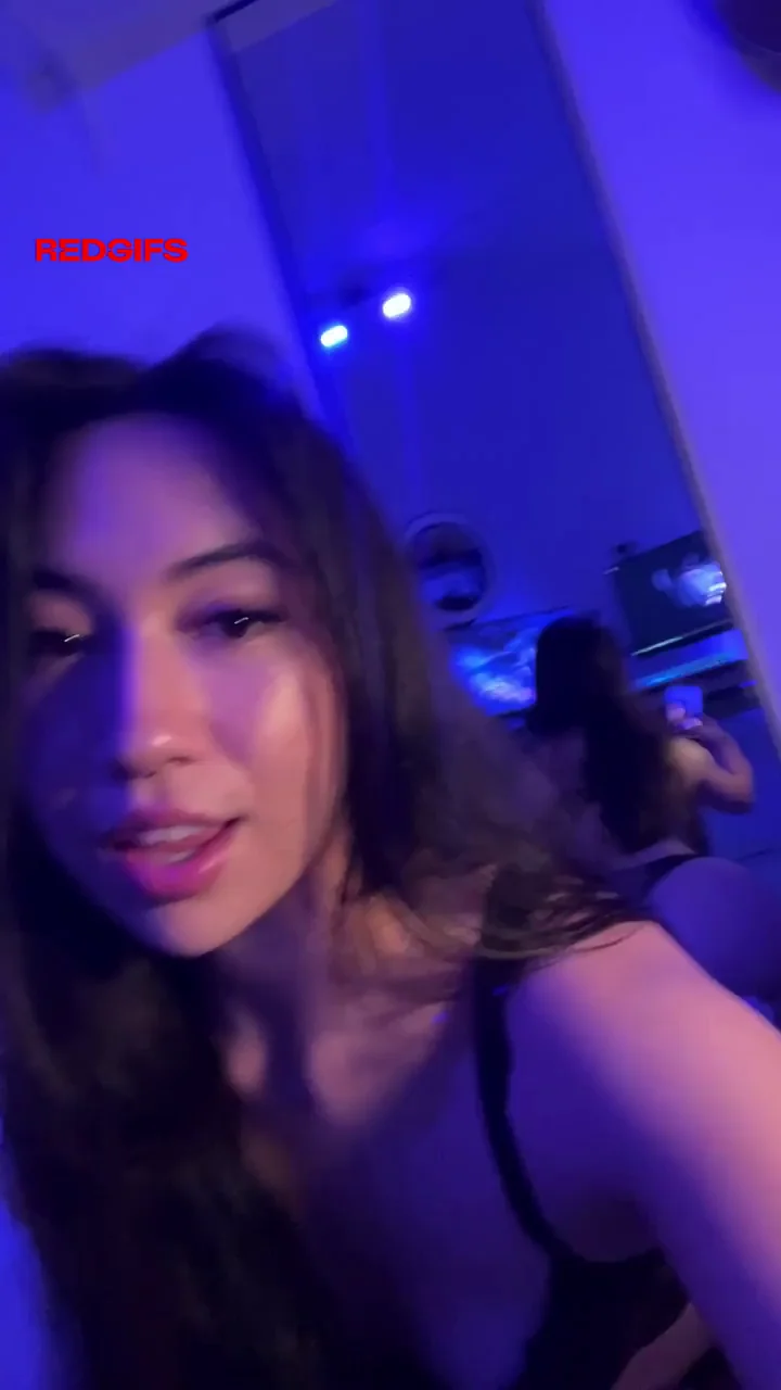 Half-Thai Cutie Teases Her Perky Tits in Neon Glow