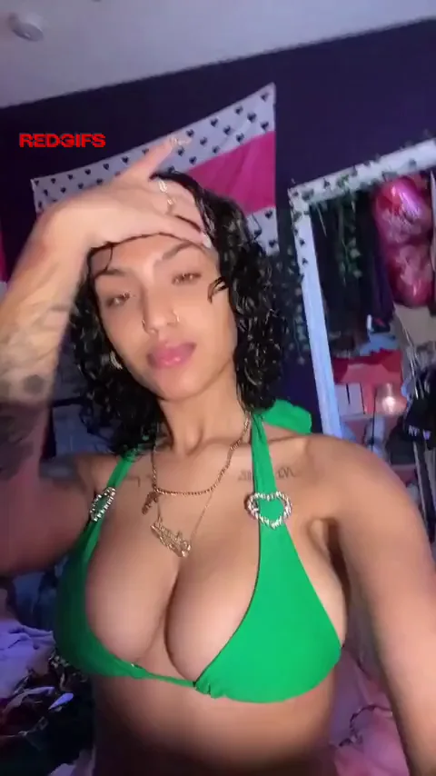 Thick Ebony Babe Teases Massive Tits in Emerald Bikini