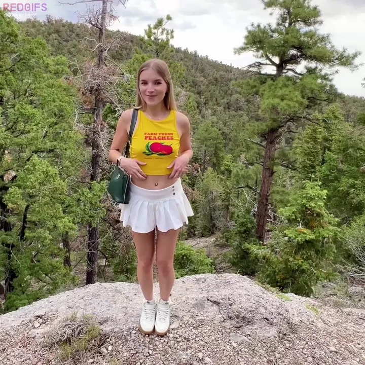 Cute Blonde Flashes B-Cup Titties on Mountain Rock