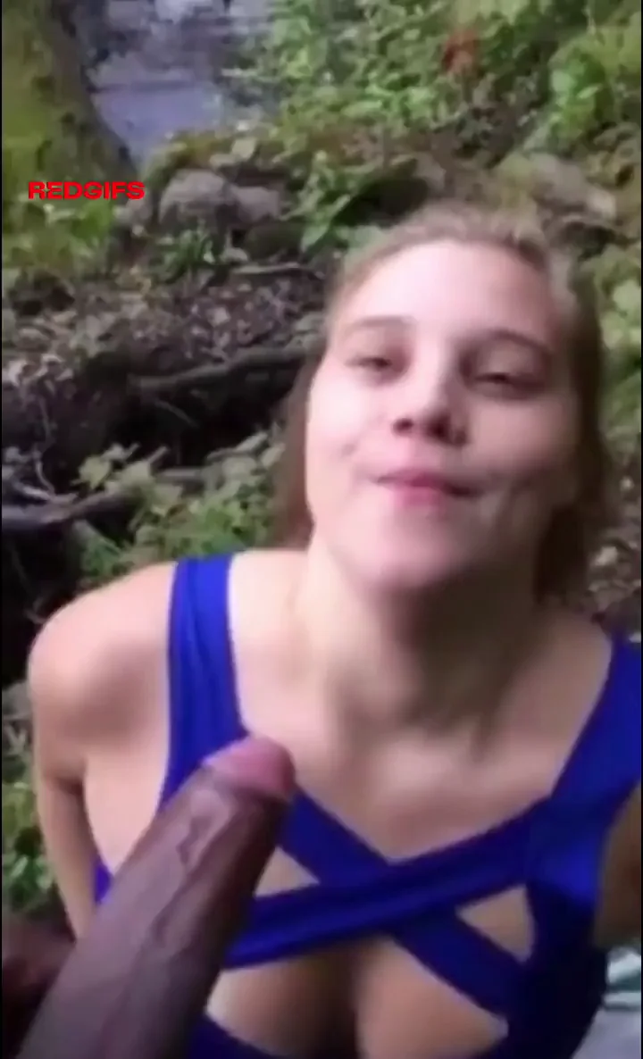 White girl on her knees sucking big black cock in the woods
