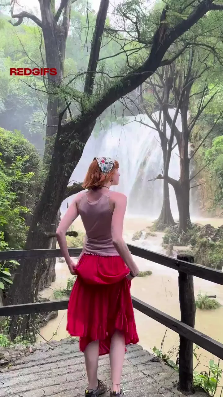 Redhead Slut Flashes Fat Ass at Waterfall View