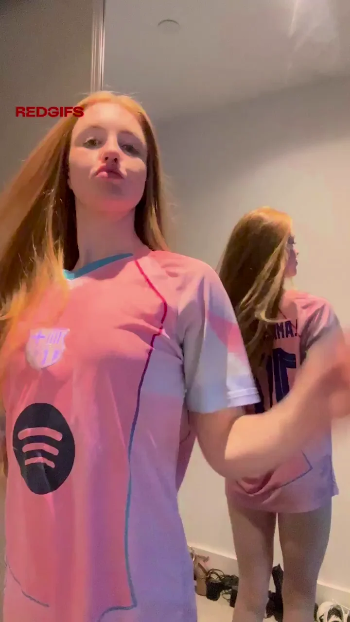 Fiery Redhead Slut Strips Bare in Pink Jersey Tease