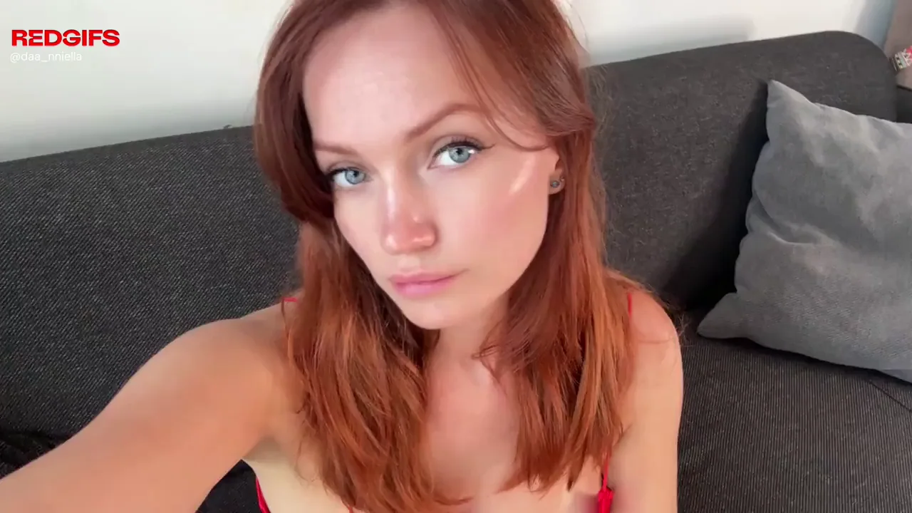 Fiery Redhead's Massive Tits Spill Out in Slutty Red Lingerie Tease