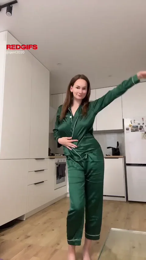 Satin Green Tease: Kitchen Strip Slut Drops the Jumpsuit