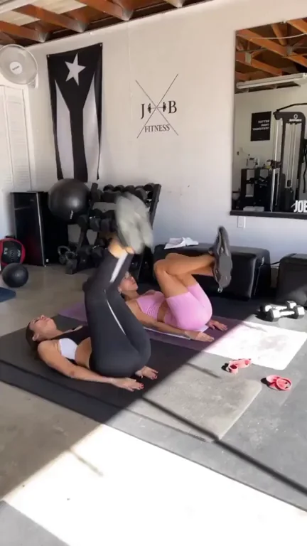 Victoria Justice, in legs raised position.