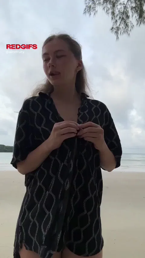 pretty girl is walking on the beach