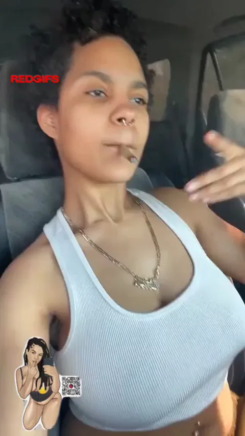 Thick Ebony Babe Lights Up Joint and Teases Massive Pierced Tits in Car