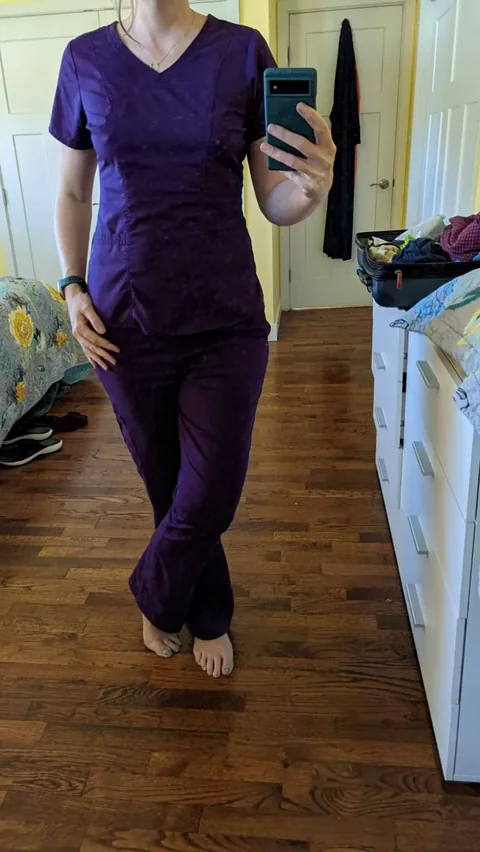 🔥 Sexy Redhead Nurse MILF Teases in Tight Purple Scrubs! Last Pic Got You Stroking? 😈