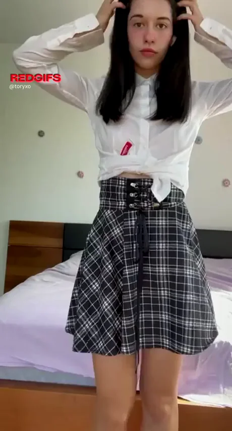 Teasing Upskirt Peek: Plaid Skirt Hides Juicy Ass & Thong
