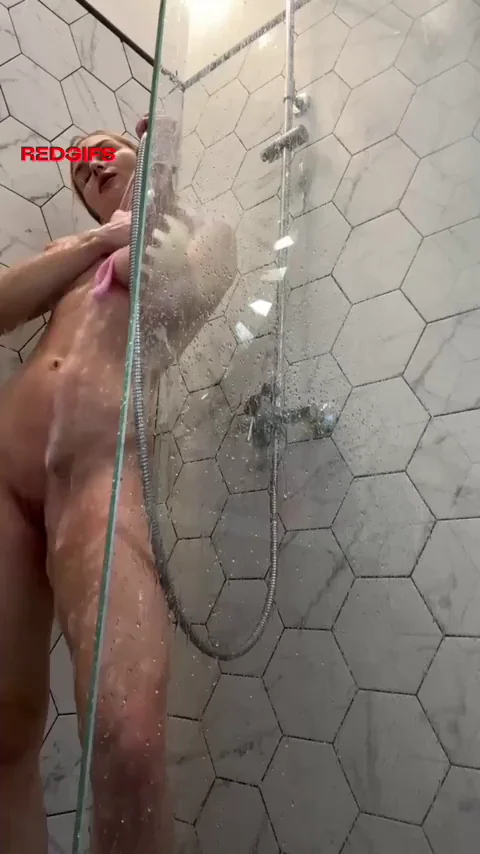 Playing with tits in shower