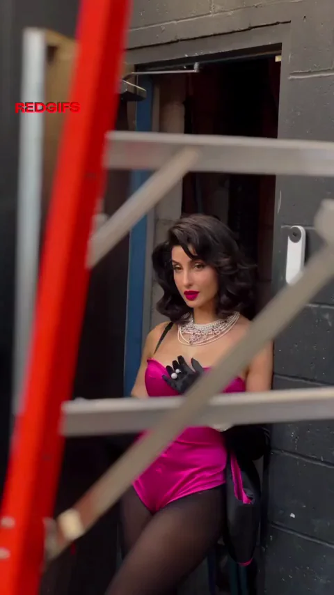 🔥 Nora Fatehi's Sultry Pink Bodysuit Tease 💋