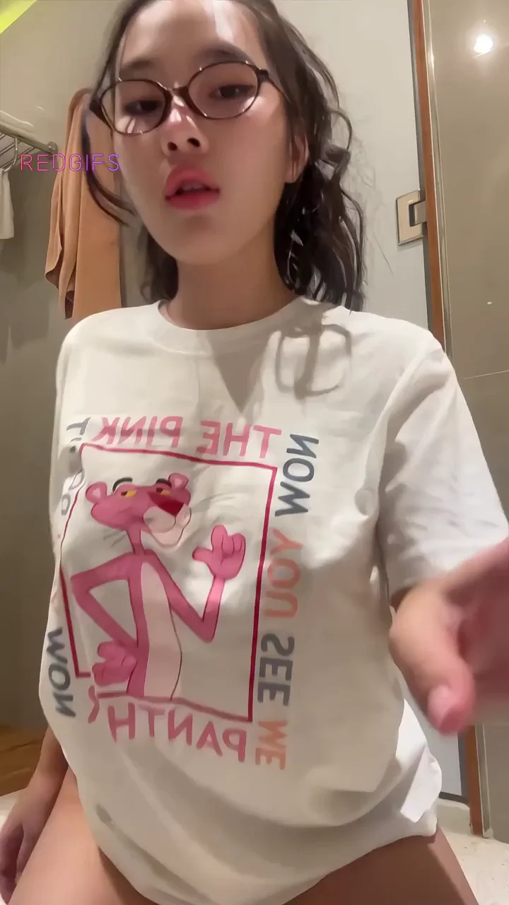Asian Busty Babe Teases with Massive Tits in Pink Panther Tee