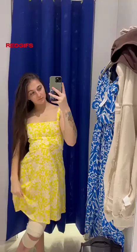 Cute Teen Twirls Her Short Yellow Dress in Changing Room Tease