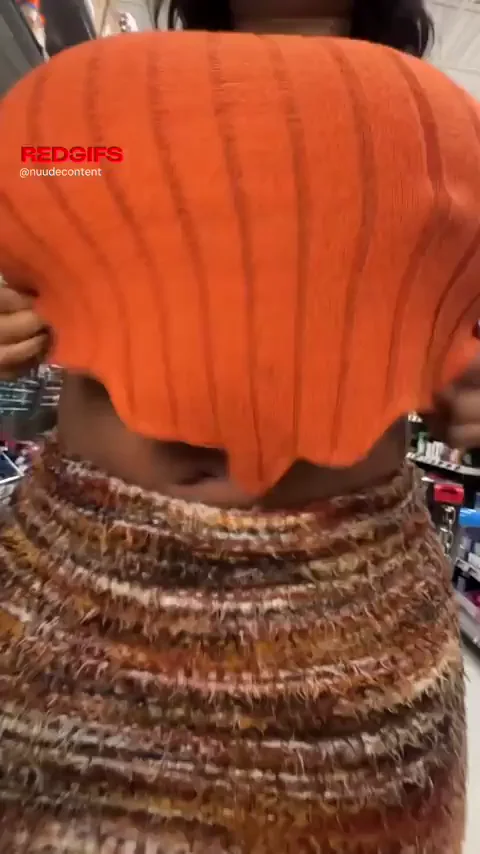 Ebony Slut's Massive Titty Drop in Public Store Tease