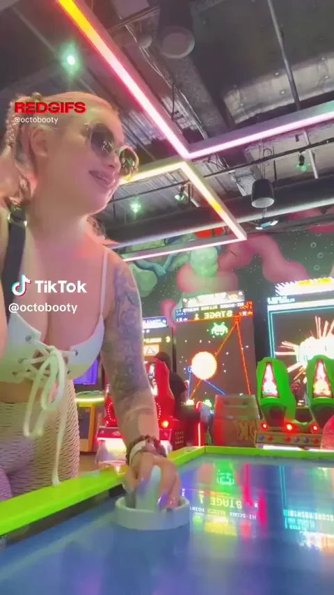 Octobooty's Massive Tits Bouncing at Air Hockey in Arcade