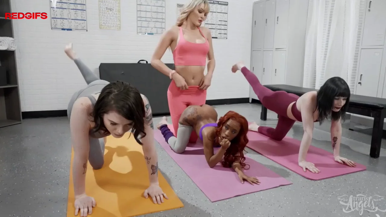 She gives her student some extra hands-on yoga training