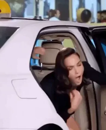 Gal Gadot getting out of a producer’s car after securing her next role