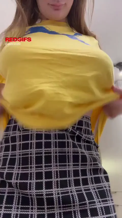 Puffy Nipple Tease: Busty Babe's Tits Burst Free from Yellow Crop Top