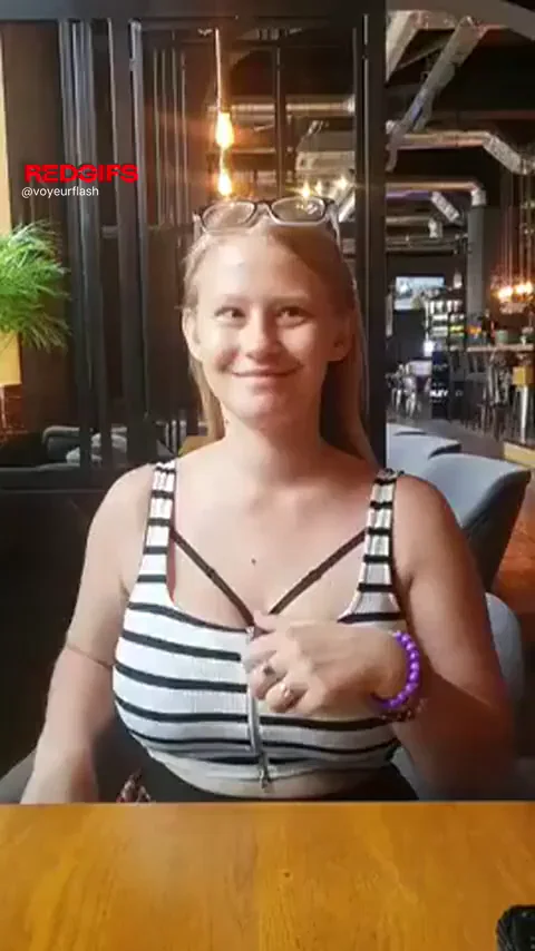 Blonde Bombshell's Risky Bar Tit Flash