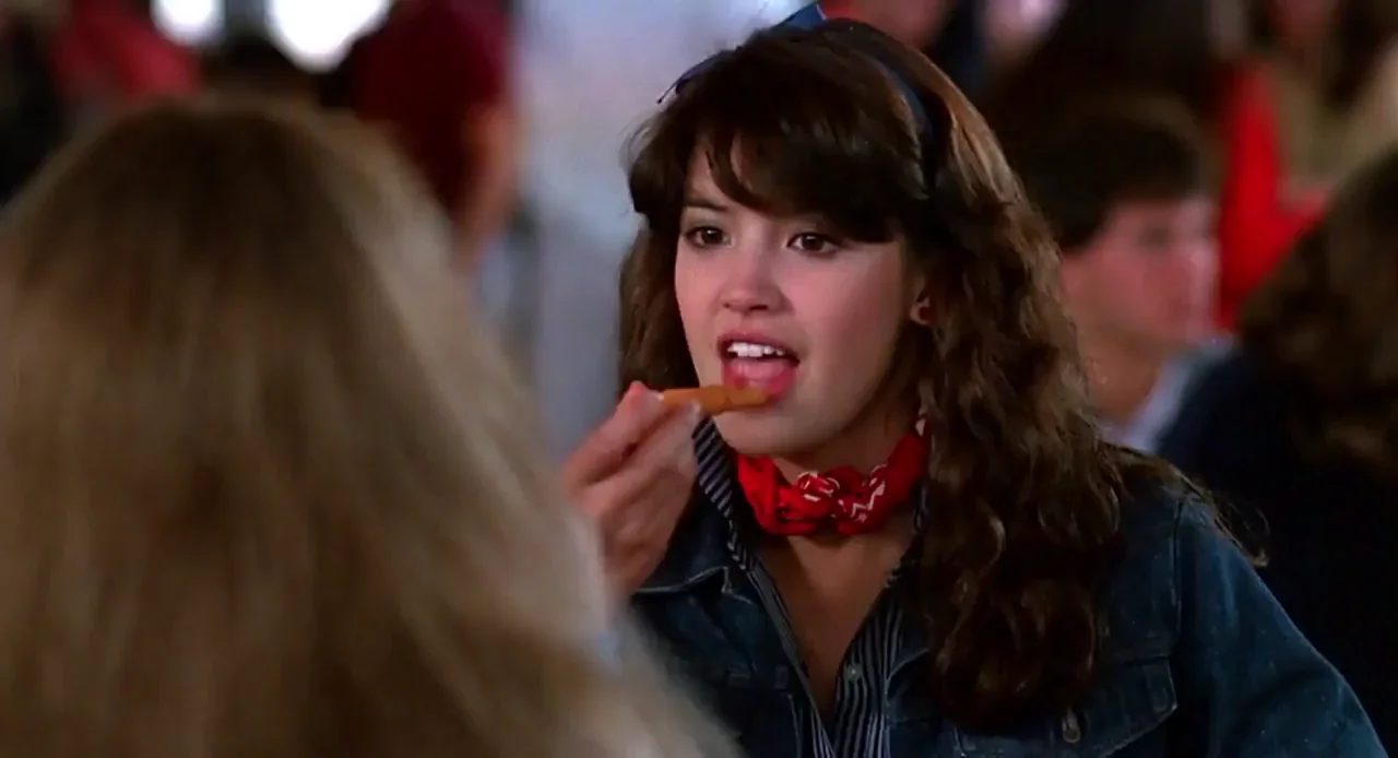 Phoebe Cates blowing a carrot in Fast Times at Ridgemont High (1982)