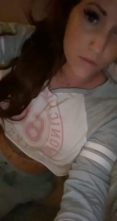 Bigger Than You Thought: Redhead Tease Lifts Shirt for Massive Tit Reveal
