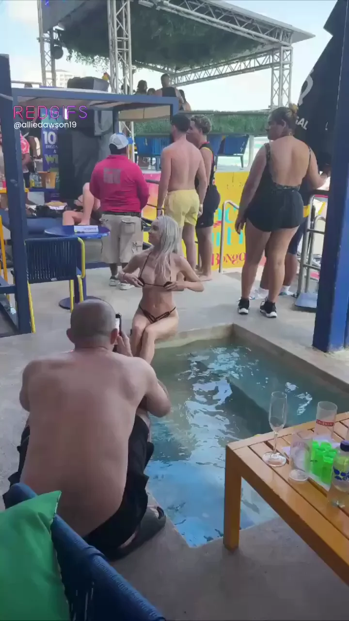Poolside Tease: Topless Slut Flaunts Her Tits in Public