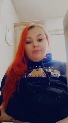 Redhead BBW Slut Flashes Her Massive Tits in Hoodie Tease