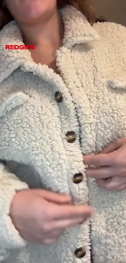 Redhead Slut in Furry Jacket Teases Her Massive Tits