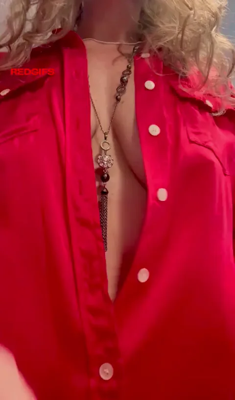 56-Year-Old MILF Teases with Massive Tits in Red Shirt