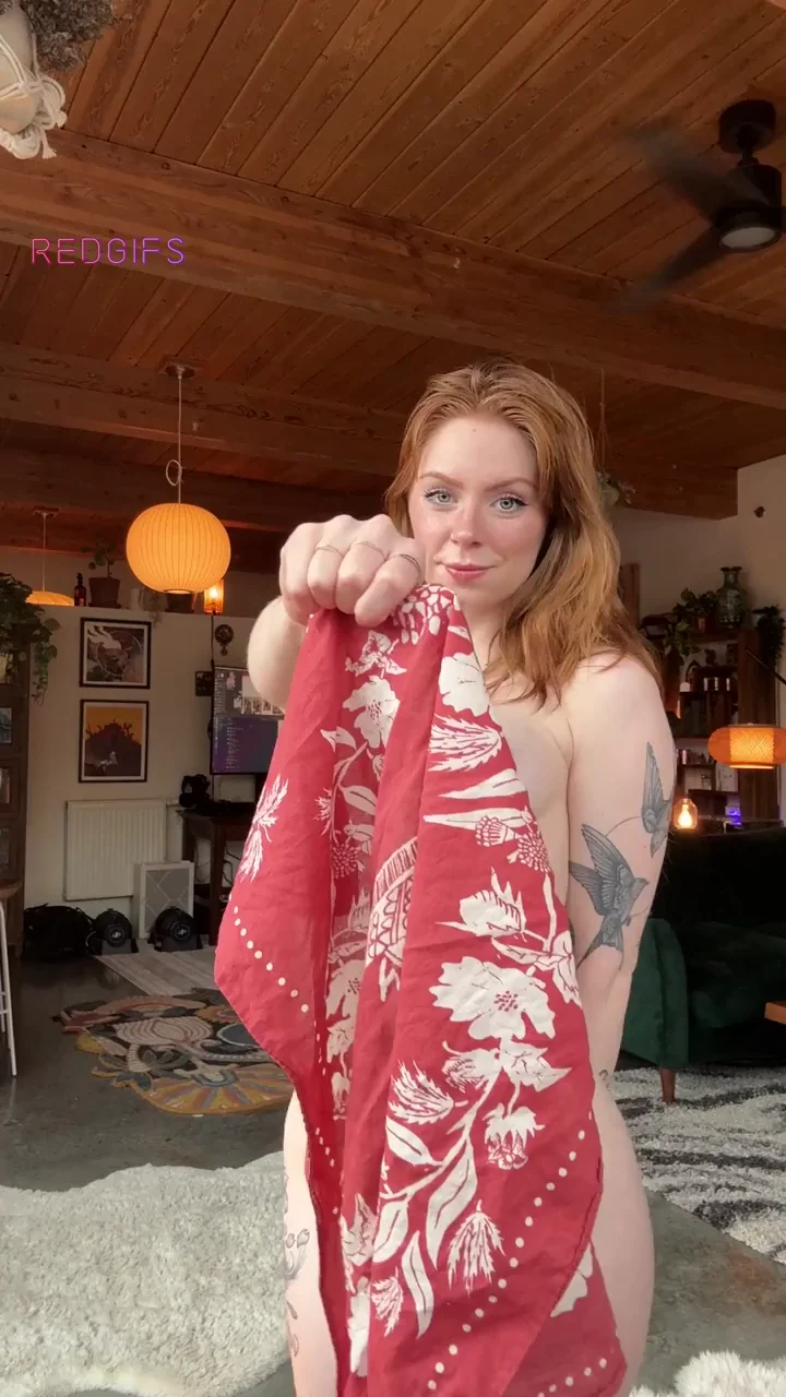 Redhead Slut Holds Up Fabric Teasing Her Massive Tits and Curves