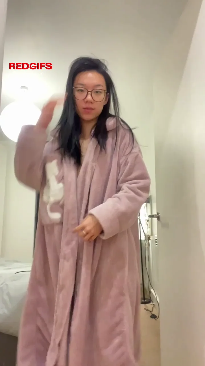 Petite Asian Cutie in Glasses Teases with Big Ass Strip in Bedroom