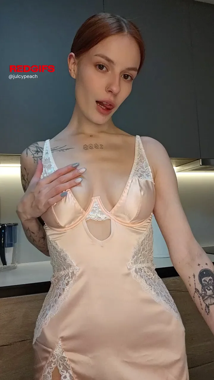 Inked Redhead Teases Her Perky Tits Under Lacy Nightie Slip