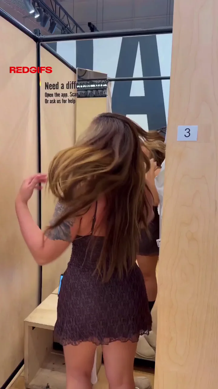 Trying on tight brown minidress